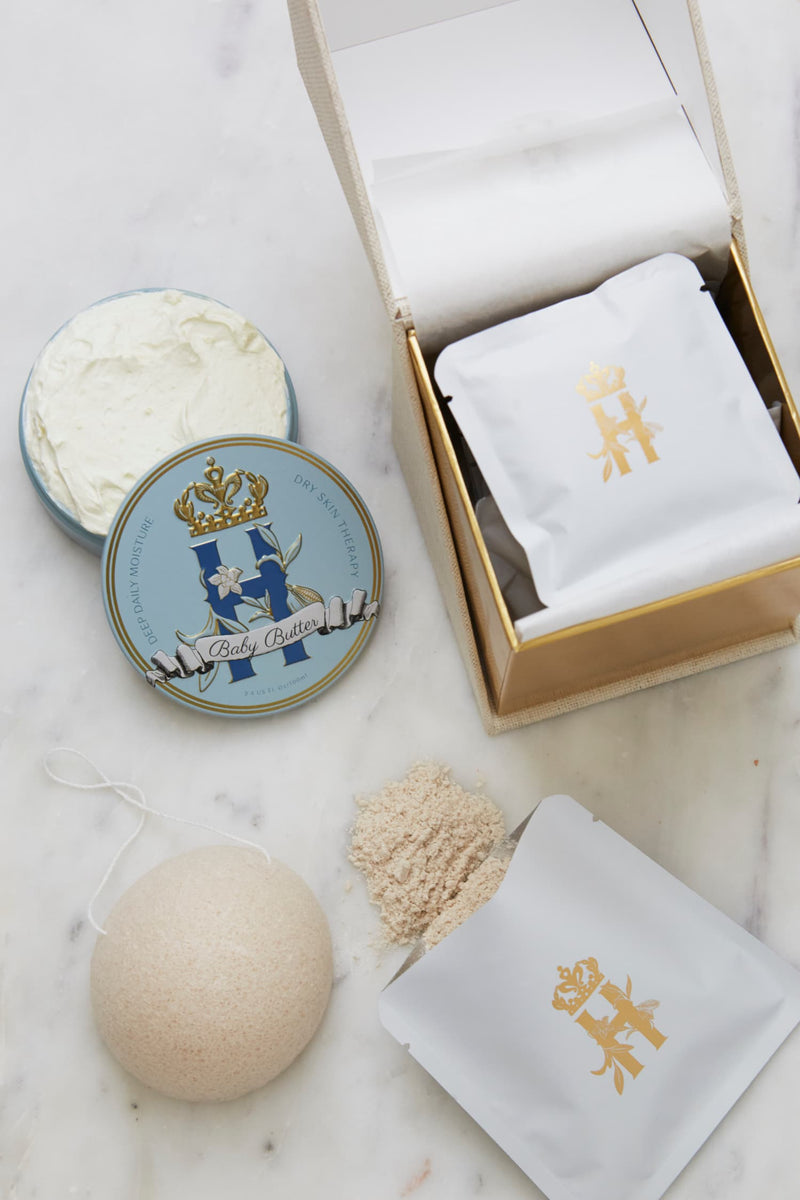 Open ritual box with a Butter in Blue tin, an open tin of butter, soak sachets and a konjac sponge
