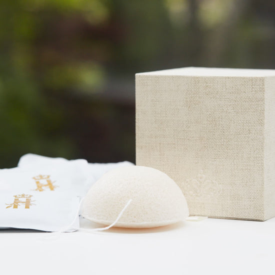 Linen gift box, soak sachets and a konjac sponge outdoors