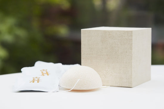 Linen gift box, soak sachets and a konjac sponge outdoors